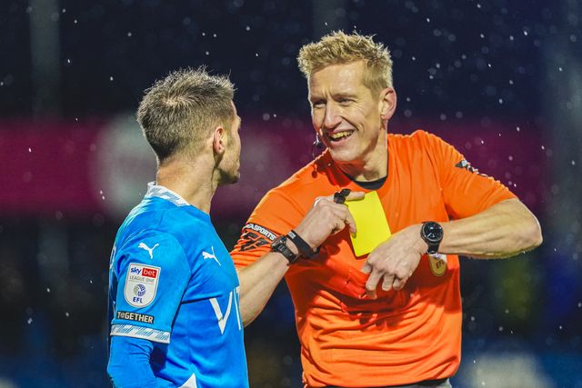 Referee Scott Oldham laughing with Stockport County Midfielder Oliver Norwood during the Sky Bet League 1 match Stockport County vs Exeter City at Edgeley Park Stadium, Stockport, United Kingdom, 7th December 2024

(Photo by James Giblin/News Images)