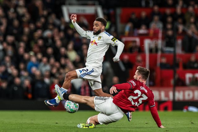 Jayden Bogle of Leeds United is tackled by Luke Shaw of Manchester United during the Premier League match Manchester United vs Leeds United at Old Trafford, Manchester, United Kingdom on 13 April 2026

(Photo by Mark Cosgrove/News Images)