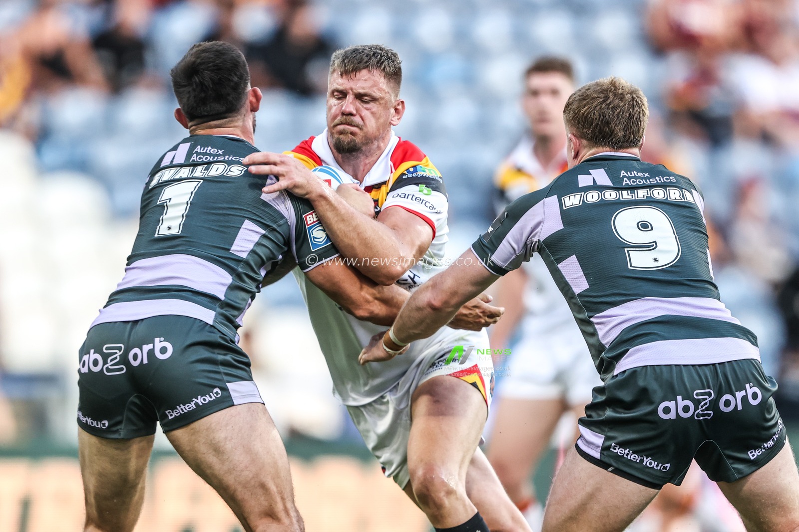 Ryan Sutton of Bradford Bulls is tackled by Niall Evalds of Huddersfield Giants and Zac Woolford of Huddersfield Giants during the Betfred Super League round 18 match Huddersfield Giants vs Bradford Bulls at Accu Stadium, Huddersfield, United Kingdom on 10 July 2026

(Photo by Alfie Cosgrove/News Images)