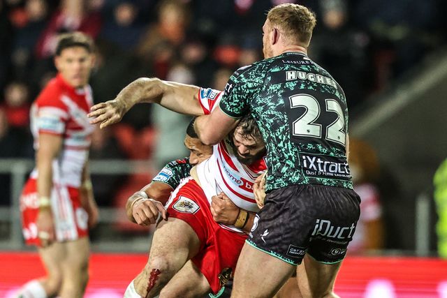 Alex Walmsley of St Helens is tackled by Jack Hughes of Leigh Leopards during the Betfred Super League match St Helens vs Leigh Leopards at The BrewDog Stadium, St Helens, United Kingdom on 20 February 2026

(Photo by Alfie Cosgrove/News Images)