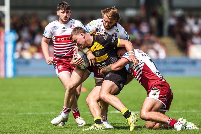 Oli Field of York Knights is tackled by Adam Keighran of Wigan Warriors during the Betfred Super League round 15 match York Knights vs Wigan Warriors at LNER Community Stadium, York, United Kingdom on 20 June 2026

(Photo by Alfie Cosgrove/News Images)
