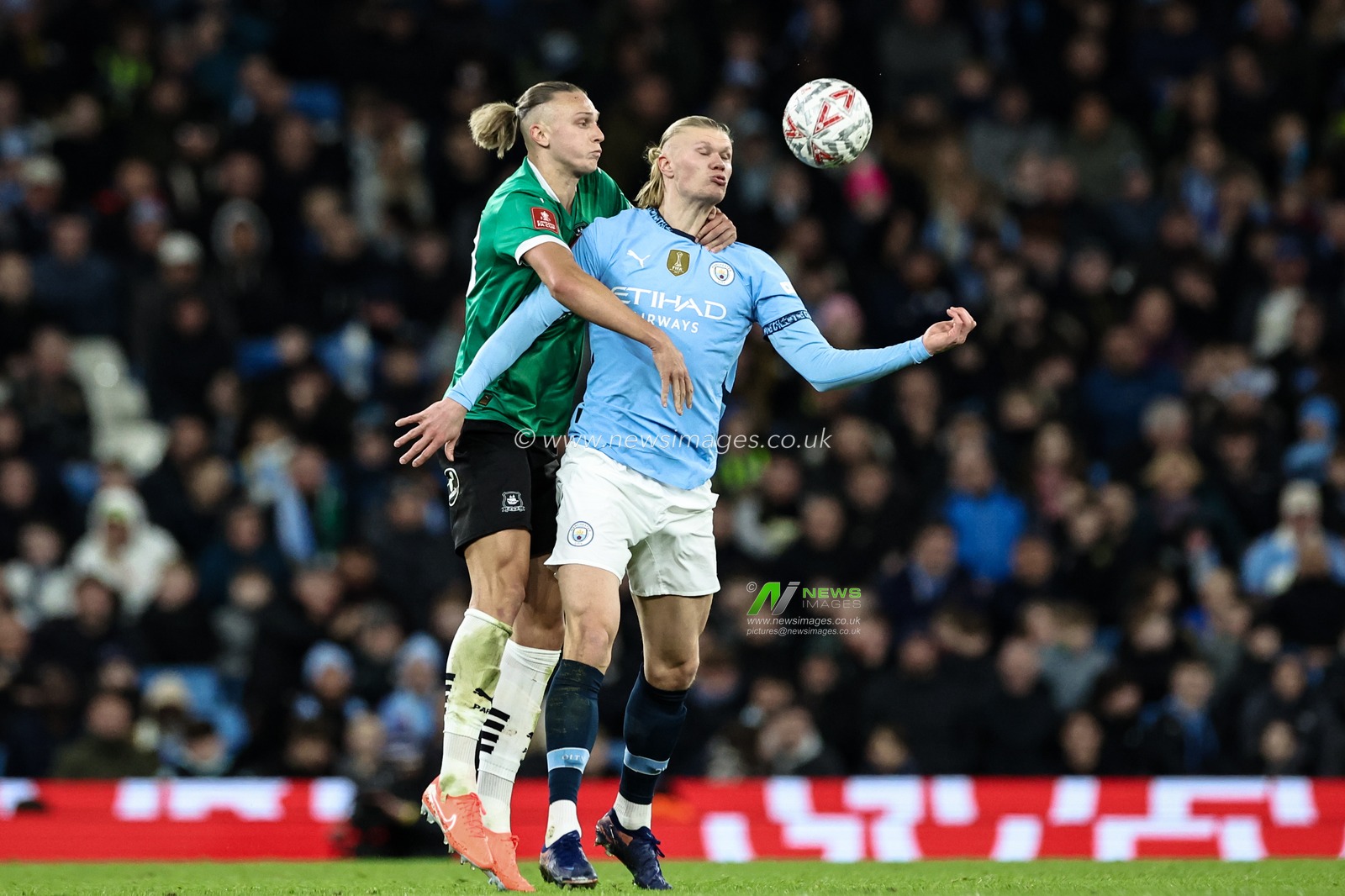 Maksym Talovierov of Plymouth Argyle and Erling Haaland of Manchester City battle for the ball during the Emirates FA Cup 5th Round match Manchester City vs Plymouth Argyle at Etihad Stadium, Manchester, United Kingdom, 1st March 2025

(Photo by Mark Cosgrove/News Images)
