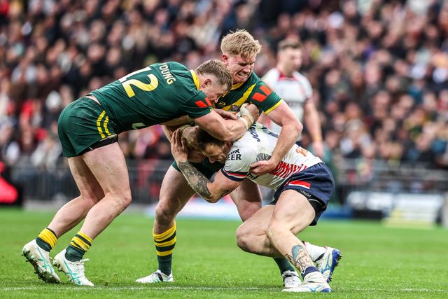 Tom Johnstone of England is tackled by Hudson Young of Australia and Tom Dearden of Australia during the The Ashes Series 2025 England vs Australia at Wembley Stadium, London, United Kingdom, 25th October 2025

(Photo by Alfie Cosgrove/News Images)