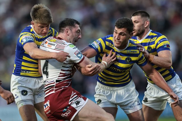 Jake Wardle of Wigan Warriors is tackled by Ewan Irwin of Warrington Wolves during the Betfred Super League round 9 match Warrington Wolves vs Wigan Warriors at The Halliwell Jones Stadium, Warrington, United Kingdom on 24 April 2026

(Photo by Mark Cosgrove/News Images)