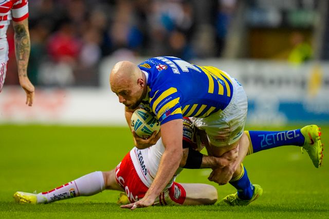 James Harrison of Warrington Wolves is tackled by Deon Cross of St Helens R.F.C. during the Betfred Super League round 14 match St Helens vs Warrington Wolves at The BrewDog Stadium, St Helens, United Kingdom on 11 June 2026

(Photo by Maynard Manyowa/News Images)