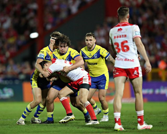 Max Wood of Warrington Wolves and Ewan Irwin of Warrington Wolves tackle Arthur Morgue of Hull KR during the Betfred Super League round 27 match Hull KR vs Warrington Wolves at Sewell Group Craven Park, Kingston upon Hull, United Kingdom, 18th September 2025(Photo by Sam Eaden/News Images)