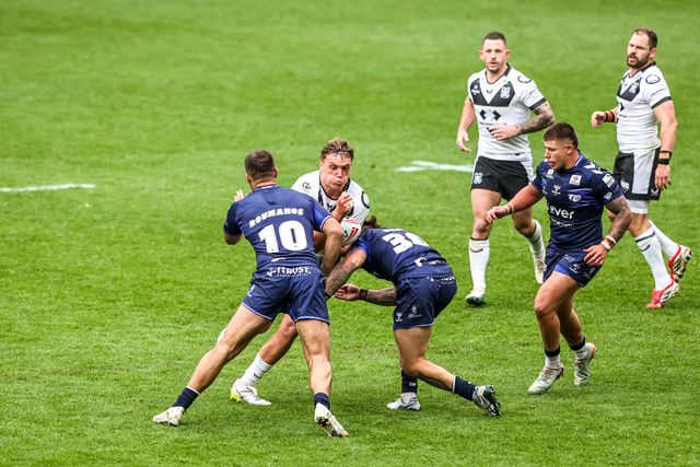 Harvie Hill of Hull FC is tackled by James Roumanos of Toulouse Olympique and Tiaki Chan of Toulouse Olympique during the Betfred Super League round 10 match Hull FC vs Toulouse Olympique at MKM Stadium, Hull, United Kingdom on 03 May 2026

(Photo by Alfie Cosgrove/News Images)