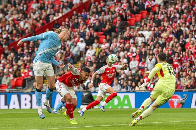 Erling Haaland of Manchester City heads the ball toward goal under challenge from William Saliba of Arsenal during the Carabao Cup Final match Arsenal vs Manchester City at Emirates, London, United Kingdom on 22 March 2026

(Photo by Alfie Cosgrove/News Images)