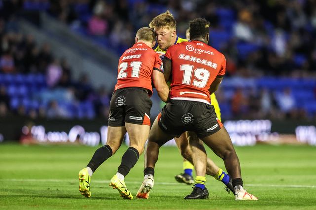 Luke Thomas of Warrington Wolves is tackled during the Betfred Super League Round 24 match Warrington Wolves vs Salford Red Devils at Halliwell Jones Stadium, Warrington, United Kingdom, 29th August 2025

(Photo by Alfie Cosgrove/News Images)