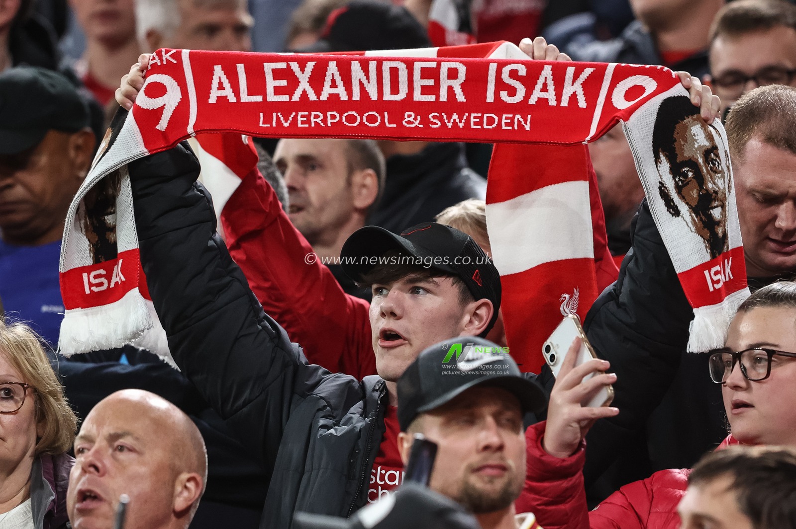 A Liverpool fans with a Alexander Isak of Liverpool scarf during the UEFA Champions League, League Stage Liverpool vs Atletico Madrid at Anfield, Liverpool, United Kingdom, 17th September 2025

(Photo by Alfie Cosgrove/News Images)