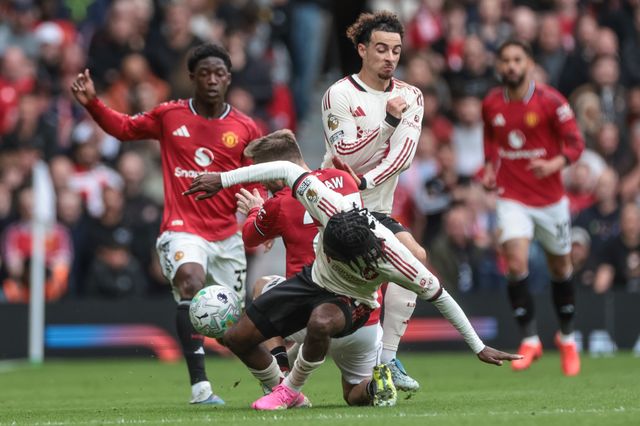 Luke Shaw of Manchester United and Jeremie Frimpong of Liverpool battle for the ball during the Premier League match Manchester United vs Liverpool at Old Trafford, Manchester, United Kingdom on 03 May 2026

(Photo by Mark Cosgrove/News Images)