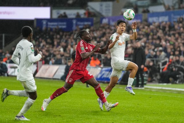 Eom Ji-Sung of Swansea City  jumps for the ball during the Carabao Cup 3rd Round Swansea City vs Nottingham Forest at Swansea.com Stadium, Swansea, United Kingdom, 17th September 2025

(Photo by Andrew Lewis/News Images)