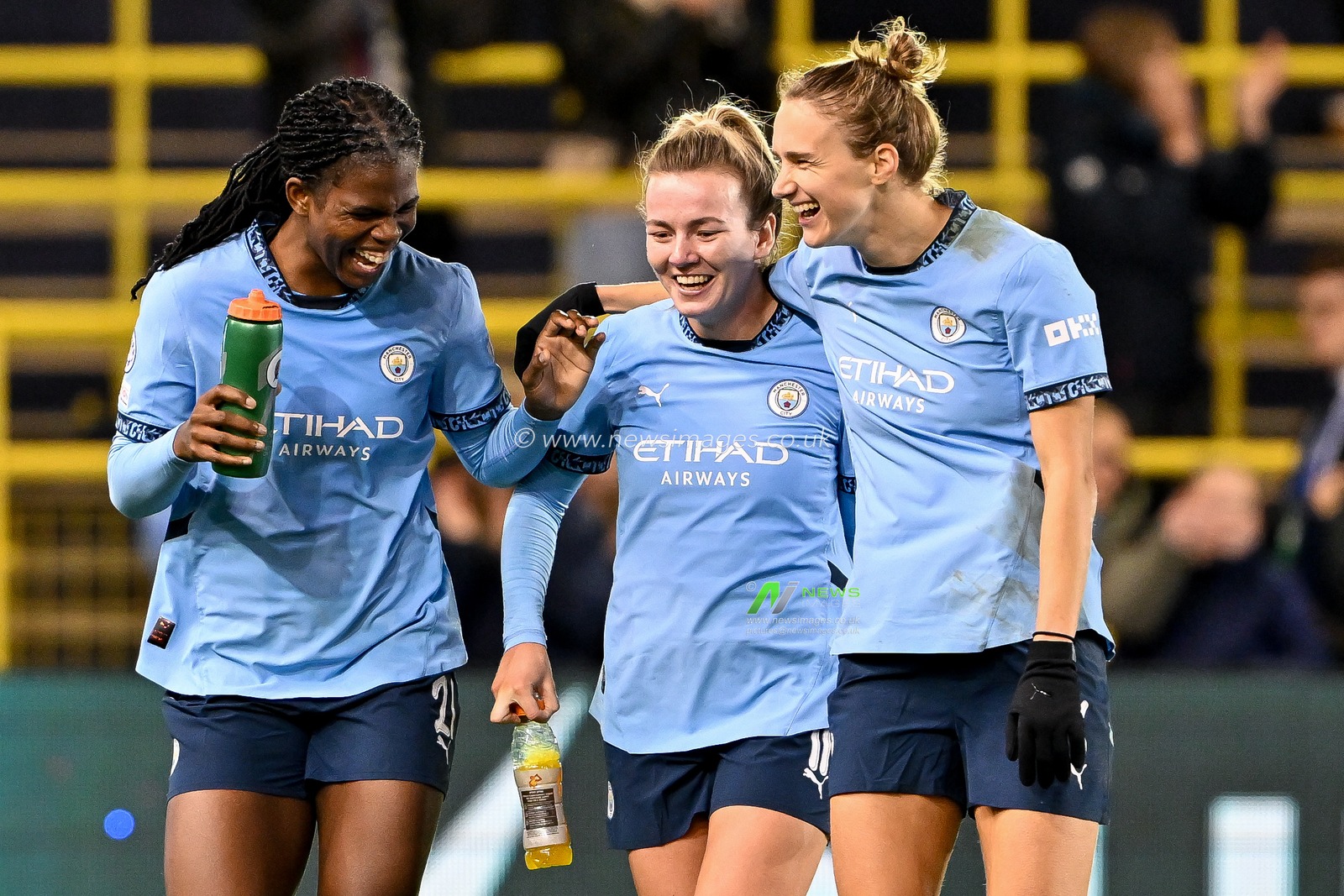 Khadija Shaw, Lauren Hemp and Vivianne Miedema of Manchester City Women celebrate after the teams victory following the UEFA Women's Champions League match  - Group D - Manchester City vs Barcelona at Manchester City Academy Stadium, Manchester, United Kingdom, 9th October 2024

(Photo by Cody Froggatt/News Images)