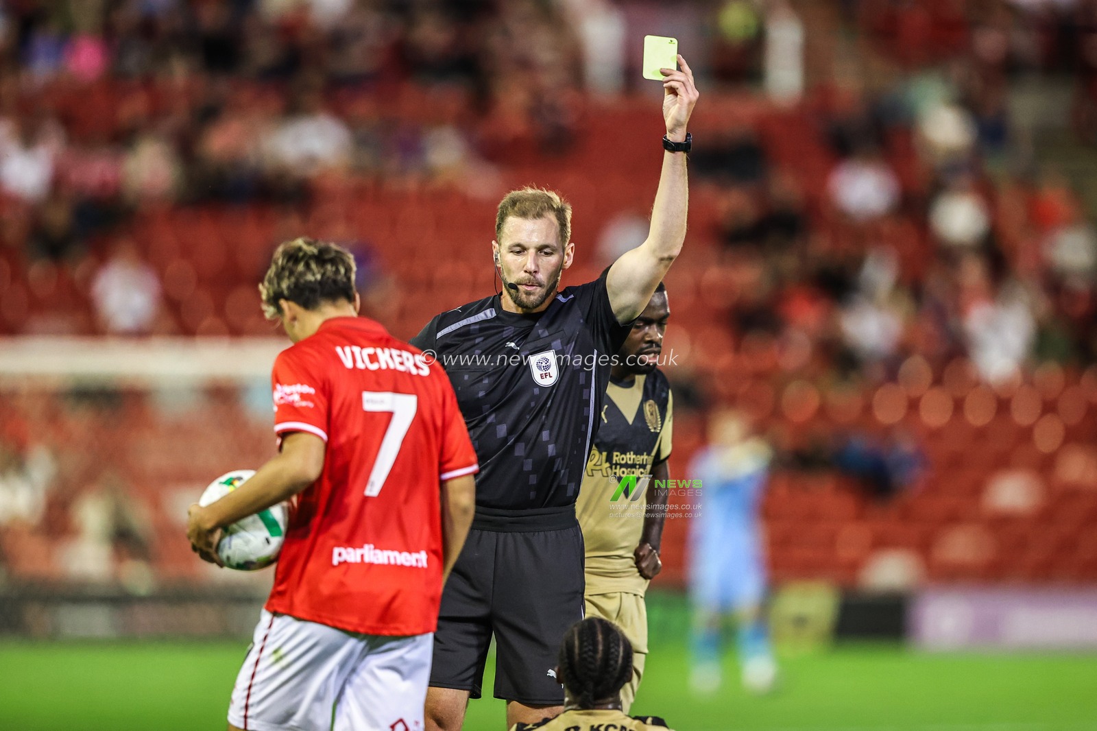 Referee Matt Corlett gives a yellow card to Ar'Jany Martha of Rotherham United during the Carabao Cup match Barnsley vs Rotherham United at Oakwell, Barnsley, United Kingdom, 26th August 2025

(Photo by Alfie Cosgrove/News Images)