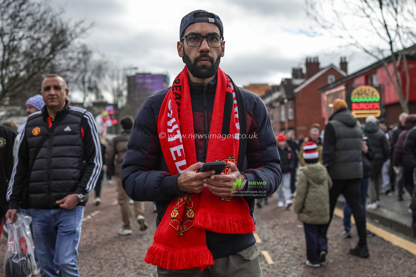 Manchester United fans make their way to Old Trafford during the Premier League match Manchester United vs Crystal Palace at Old Trafford, Manchester, United Kingdom on 01 March 2026

(Photo by Mark Cosgrove/News Images)