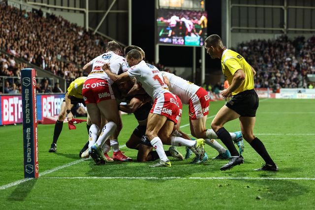 St Helens push Bevan French of Wigan Warriors out of play during the Betfred Super League Round 25 match St Helens vs Wigan Warriors at Totally Wicked Stadium, St Helens, United Kingdom, 5th September 2025

(Photo by Mark Cosgrove/News Images)