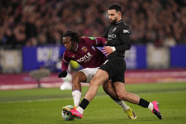 Rayan Ait-Nouri of Manchester City tackles Aaron Wan-Bissaka of West Ham United during the Premier League match West Ham United vs Manchester City at London Stadium, London, United Kingdom on 14 March 2026

(Photo by Harvey Murphy/News Images)