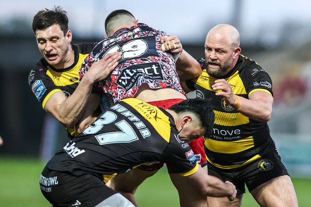 Innes Senior of Leigh Leopards is tackled by Sam Wood of York Knights and Paul McShane of York Knights during the Betfred Super League round 8 match York Knights vs Leigh Leopards at LNER Community Stadium, York, United Kingdom on 17 April 2026

(Photo by Alfie Cosgrove/News Images)