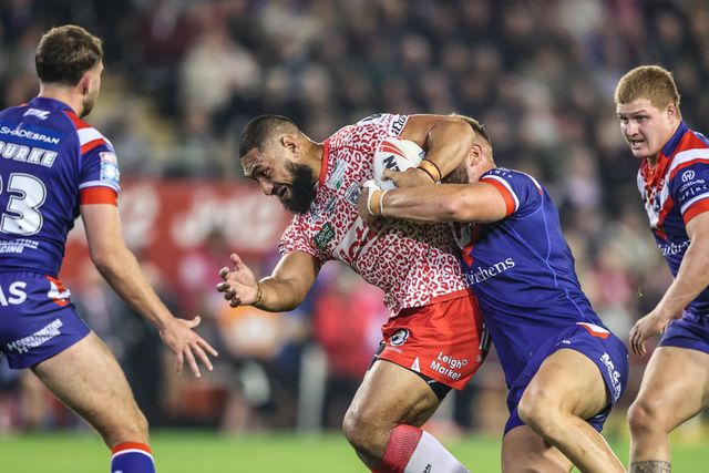 Isaac Liu of Leigh Leopards is tackled during the Betfred Super League play-off Eliminator 1 match Leigh Leopards vs Wakefield Trinity at Progress With Unity Stadium, Leigh, United Kingdom, 26th September 2025

(Photo by Alfie Cosgrove/News Images)