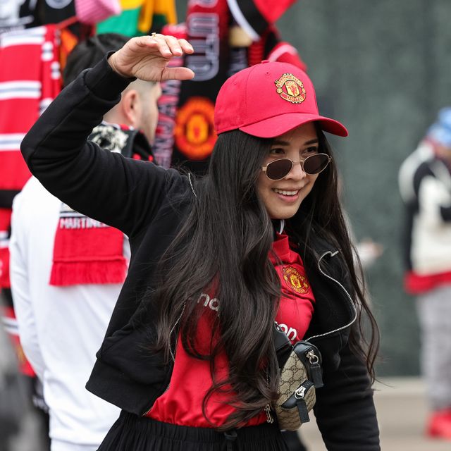 Manchester United fans pose for photos outside Old Trafford during the Premier League match Manchester United vs Liverpool at Old Trafford, Manchester, United Kingdom on 03 May 2026

(Photo by Mark Cosgrove/News Images)