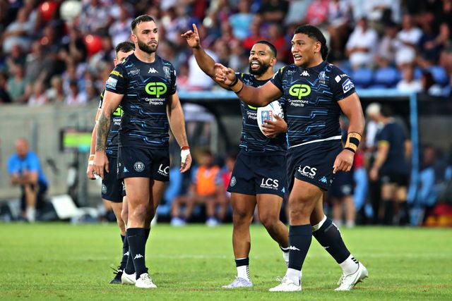 Kruise Leeming of Wigan Warriors and Patrick Mago of Wigan Warriors make a captains challenge during the Betfred Super League round 15 match Wakefield Trinity vs Wigan Warriors at DIY Kitchens Stadium, Wakefield, United Kingdom, 20th June 2025

(Photo by Sam Eaden/News Images)