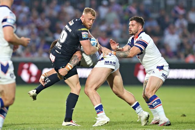 Jack Croft of Wakefield Trinity tackles Luke Thompson of Wigan Warriors during the Betfred Super League round 15 match Wakefield Trinity vs Wigan Warriors at DIY Kitchens Stadium, Wakefield, United Kingdom, 20th June 2025

(Photo by Sam Eaden/News Images)