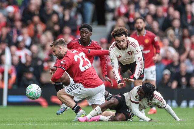 Luke Shaw of Manchester United and Jeremie Frimpong of Liverpool battle for the ball during the Premier League match Manchester United vs Liverpool at Old Trafford, Manchester, United Kingdom on 03 May 2026

(Photo by Mark Cosgrove/News Images)