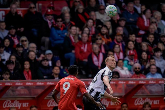 Dan Burn of Newcastle United battles for the ball  in the air with Taiwo Awoniyi of Nottingham Forest during the Premier League match Nottingham Forest vs Newcastle Untied at City Ground, Nottingham, United Kingdom on 10 May 2026

(Photo by Maynard Manyowa/News Images)