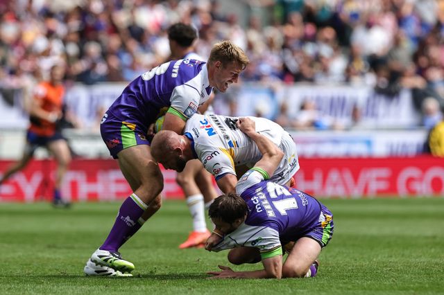 Jarrod O'Connor of Leeds Rhinos is tackled by Jack Ormondroyd and Keenan Palasia of Leeds Rhinos during the Betfred Super League Magic Weekend match Leeds Rhinos vs Bradford Bulls at Hill Dickinson Stadium, Liverpool, United Kingdom on 05 July 2026

(Photo by Mark Cosgrove/News Images)