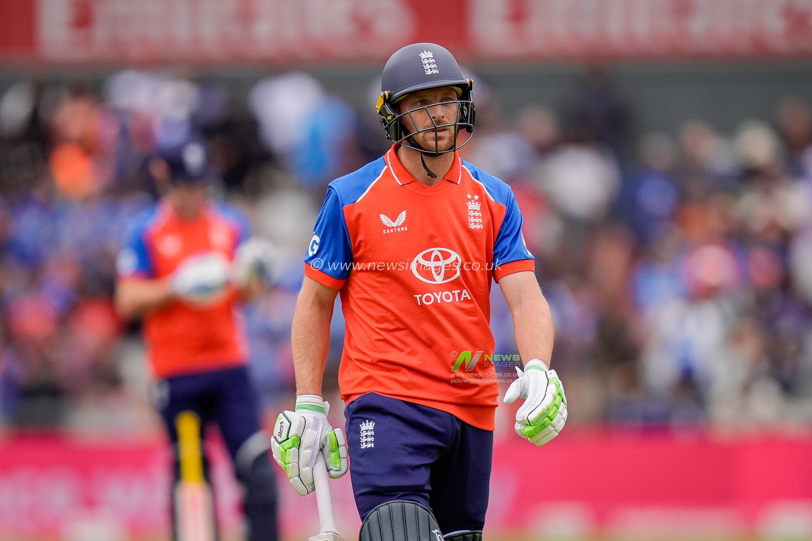 Jos Buttler of England walks off dejected after he clips the ball to mid wicket and is caught off the bowling of Arshdeep Singh of India during the Second Vitality T20 International match England vs India at Old Trafford, Manchester, United Kingdom on 04 July 2026

(Photo by Maynard Manyowa/News Images)