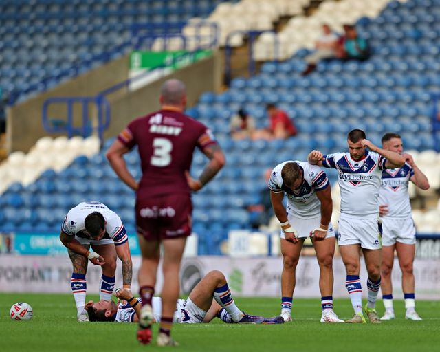 Wakefield stand dejected during the Betfred Super League round 19 match Huddersfield Giants vs Wakefield Trinity at the Accu Stadium, Huddersfield, United Kingdom, 18th July 2025

(Photo by Sam Eaden/News Images)