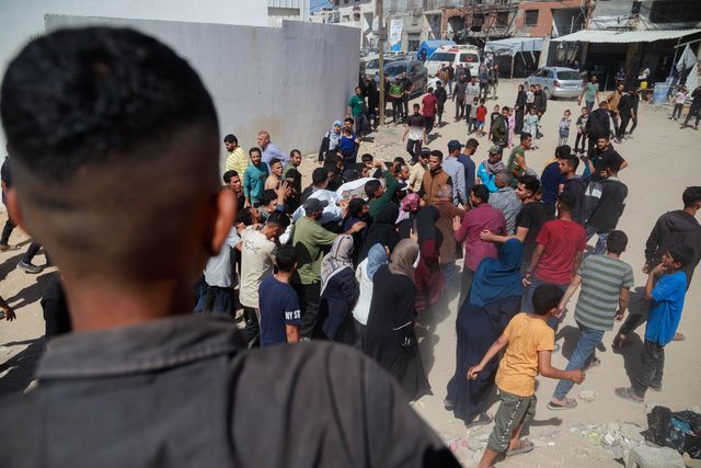 Families bid farewell to their sons killed in today's Israeli massacre at the Al-Wehda Street market in western Gaza City, which left 40 dead and a large number of injuries, including children and women.(Photo: Mohammed Skaik/News Images)