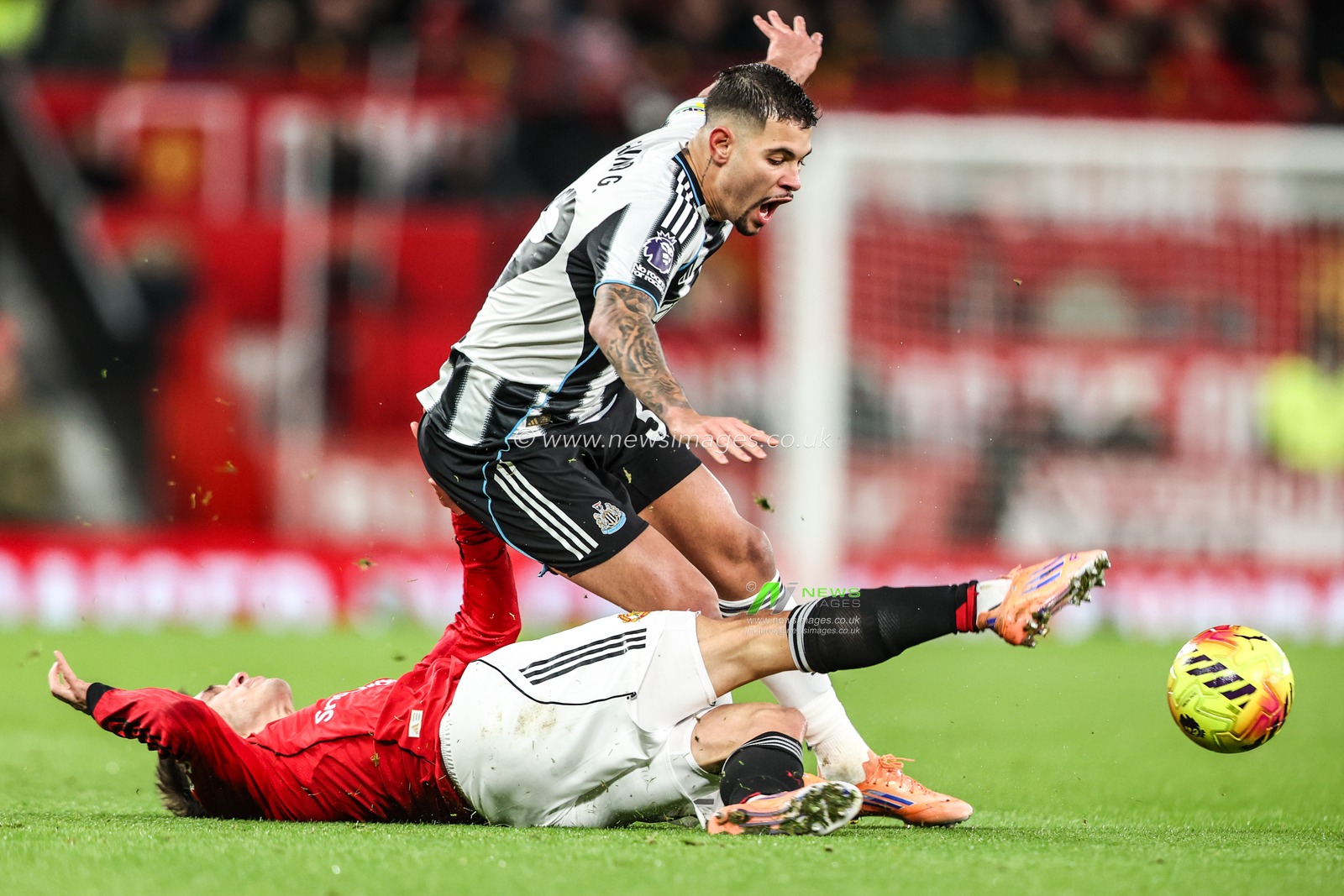 Bruno Guimaraes of Newcastle United is tackled by Manuel Ugarte of Manchester Untied during the Premier League match Manchester United vs Newcastle United at Old Trafford, Manchester, United Kingdom, 26th December 2025

(Photo by Alfie Cosgrove/News Images)

*** GER AUT SUI OUT ***