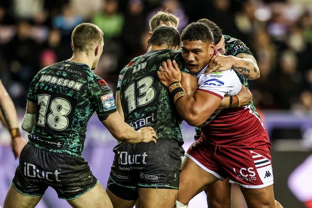 Patrick Mago of Wigan Warriors is tackled by Isaac Liu of Leigh Leopards during the Betfred Super League match Wigan Warriors vs Leigh Leopards at The Brick Community Stadium, Wigan, United Kingdom on 26 February 2026

(Photo by Alfie Cosgrove/News Images)