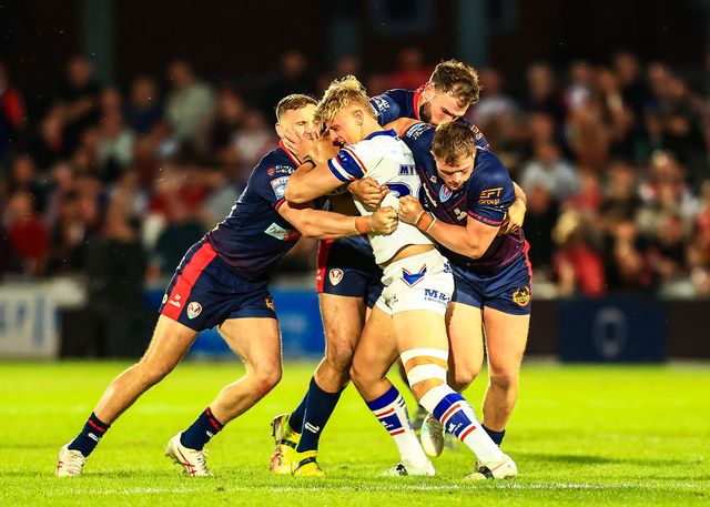 Jayden Myers of Wakefield Trinity is tackled during the Betfred Super League round 21 match Wakefield Trinity vs St Helens at DIY Kitchens Stadium, Wakefield, United Kingdom, 8th August 2025

(Photo by Richard Bierton/News Images)