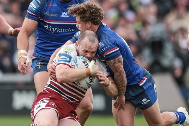 Liam Marshall of Wigan Warriors is tackled by Harvey Smith of Wakefield Trinity during the Betfred Challenge Cup Quarter Final match Wakefield Trinity vs Wigan Warriors at DIY Kitchens Stadium, Wakefield, United Kingdom on 12 April 2026

(Photo by Mark Cosgrove/News Images)
