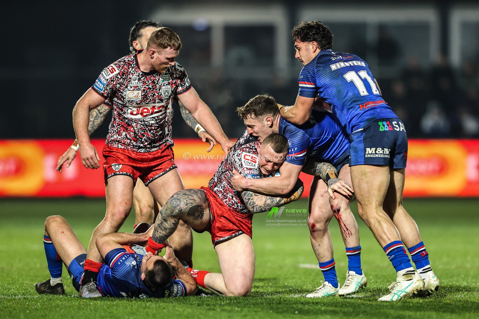 Josh Charnley of Leigh Leopards is tackled by Jake Trueman of Wakefield Trinity during the Betfred Super League round 5 match Wakefield Trinity vs Leigh Leopards at DIY Kitchens Stadium, Wakefield, United Kingdom on 20 March 2026

(Photo by Alfie Cosgrove/News Images)