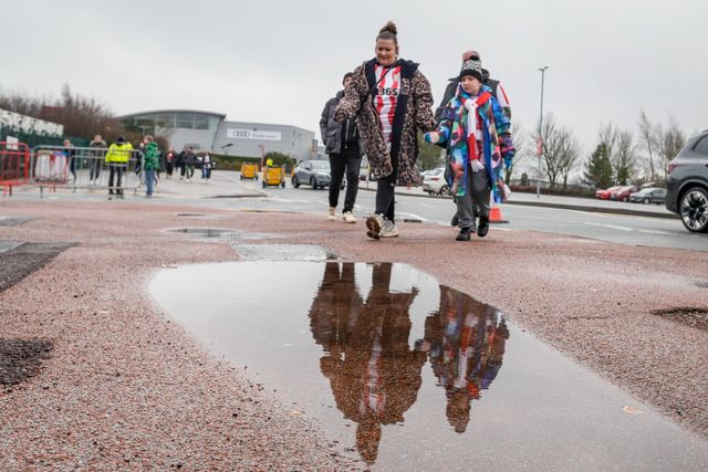 Stoke City fans walk past a puddle prior to kick off as the rain stops for a while during the Emirates FA Cup 4th Round  match Stoke City vs Fulham at Bet365 Stadium, Stoke On Trent, United Kingdom on 15 February 2026

(Photo by Maynard Manyowa/News Images)