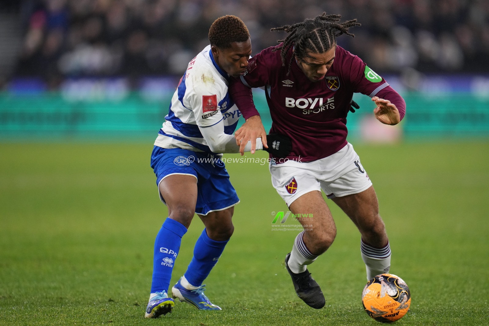 Ezra Mayers of West Ham United and Karamoko Dembélé of Queens Park Rangers during the Emirates FA Cup Third Round match West Ham United vs Queens Park Rangers at London Stadium, London, United Kingdom, 11th January 2026

(Photo by Harvey Murphy/News Images)