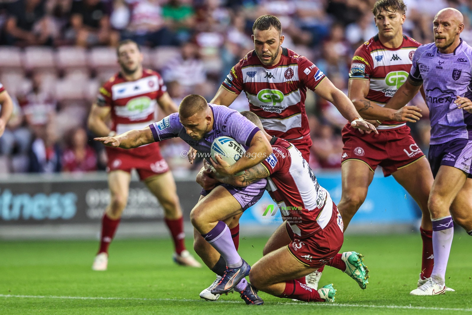 Mikey Lewis of Hull KR is tackled during the Betfred Super League round 22 match Wigan Warriors vs Hull KR at The Brick Community Stadium, Wigan, United Kingdom, 15th August 2025

(Photo by Alfie Cosgrove/News Images)