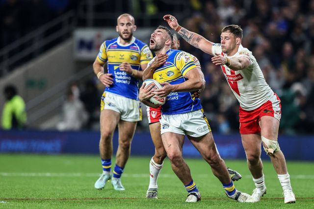Moses Mbye of St. Helens pulls Jake Connor of Leeds Rhinos to the floor conceding a penalty during the Betfred Super League play-off Eliminator 1 match Leeds Rhinos vs St Helens at Headingley Stadium, Leeds, United Kingdom, 27th September 2025

(Photo by Alfie Cosgrove/News Images)