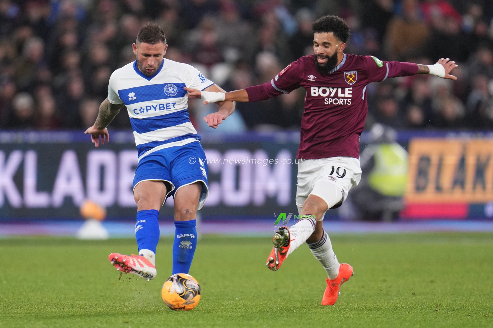 Pablo Felipe of West Ham United tries to close down Steve Cook of Queens Park Rangers during the Emirates FA Cup Third Round match West Ham United vs Queens Park Rangers at London Stadium, London, United Kingdom, 11th January 2026

(Photo by Harvey Murphy/News Images)