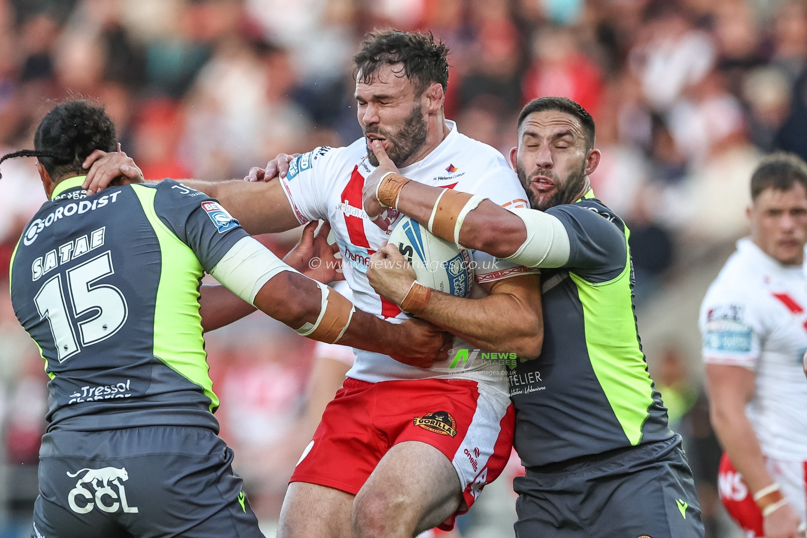 Alex Walmsley of St. Helens is tackled by Chris Satae of Catalan Dragons and Romain Navarrete of Catalan Dragons during the Betfred Super League Round 11 match St Helens vs Catalans Dragons at Totally Wicked Stadium, St Helens, United Kingdom, 15th May 2025

(Photo by Mark Cosgrove/News Images)