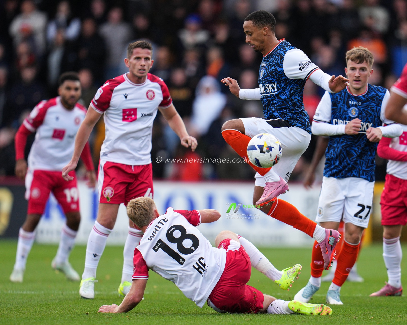Harvey White of Stevenage slides in on Cohen Bramall of Luton Town during the Sky Bet League 1 match Stevenage vs Luton Town at Lamex Stadium, Stevenage, United Kingdom, 4th October 2025

(Photo by Harvey Murphy/News Images)
