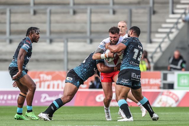 Alex Walmsley of St. Helens is tackled during the Betfred Super League round 19 match St Helens vs Leigh Leopards at Totally Wicked Stadium, St Helens, United Kingdom, 17th July 2025

(Photo by Alfie Cosgrove/News Images)