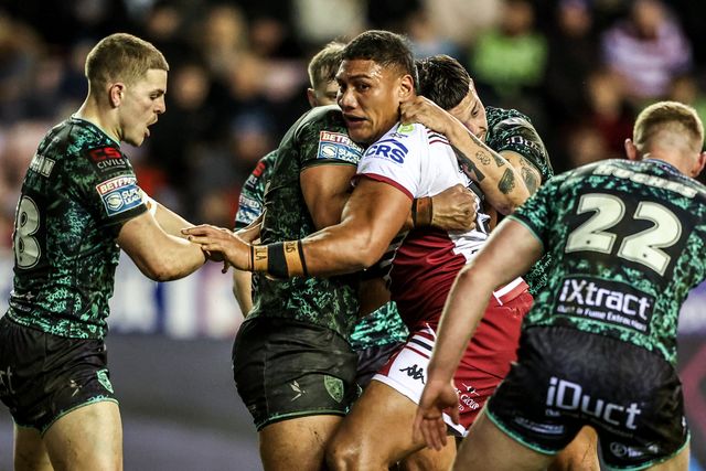 Patrick Mago of Wigan Warriors is tackled by Isaac Liu of Leigh Leopards during the Betfred Super League match Wigan Warriors vs Leigh Leopards at The Brick Community Stadium, Wigan, United Kingdom on 26 February 2026

(Photo by Alfie Cosgrove/News Images)