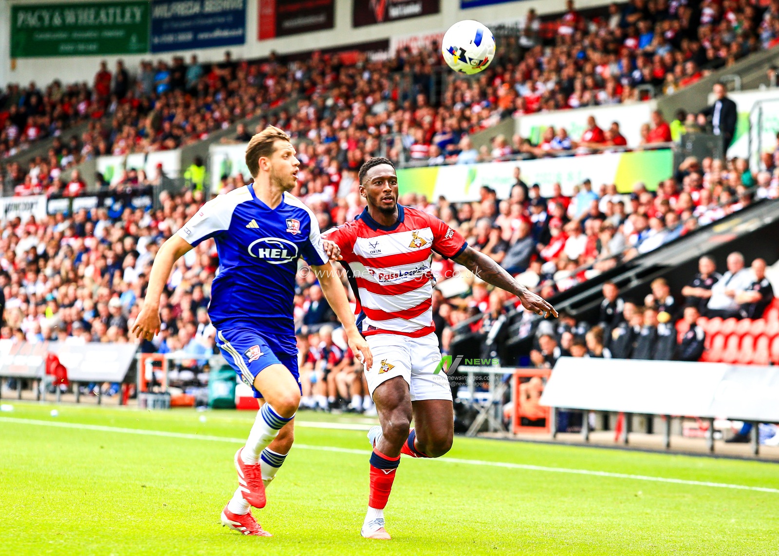 Brandon Hanlan of Doncaster Rovers and Jack Fitzwater of Exeter City battle for the ball during the Sky Bet League 1 match Doncaster Rovers vs Exeter City at Eco-Power Stadium, Doncaster, United Kingdom, 2nd August 2025

(Photo by Richard Bierton/News Images)