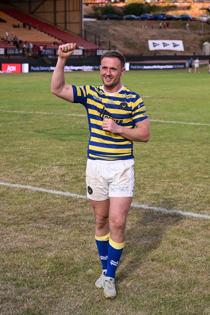 Ben Currie of Warrington Wolves shows his support towards the travelling fans following the Betfred Super League round 22 match Bradford Bulls vs Warrington Wolves at Odsal Stadium, Bradford, United Kingdom on 08 August 2026

(Photo by Ben Roberts/News Images)