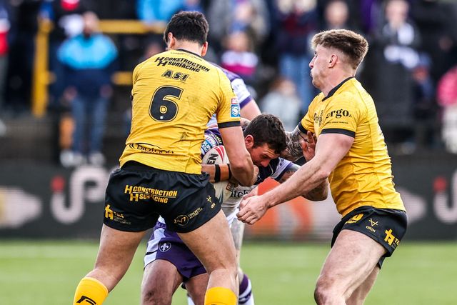 Jay Pitts of Wakefield Trinity is tackled by Daejarn Asi of Castleford Tigers during the Betfred Super League round 7 match Castleford Tigers vs Wakefield Trinity at OneBore Stadium, Castleford, Untied Kingdom on 05 April 2026

(Photo by Alfie Cosgrove/News Images)