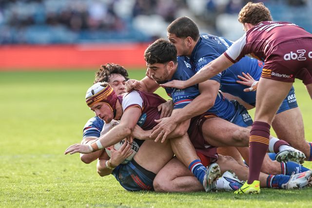 George Flanagan Jnr of Huddersfield Giants is tackled during the Betfred Super League Round 2 match Huddersfield Giants vs Wakefield Trinity at Accu Stadium, Huddersfield, United Kingdom on 22 February 2026

(Photo by Mark Cosgrove/News Images)